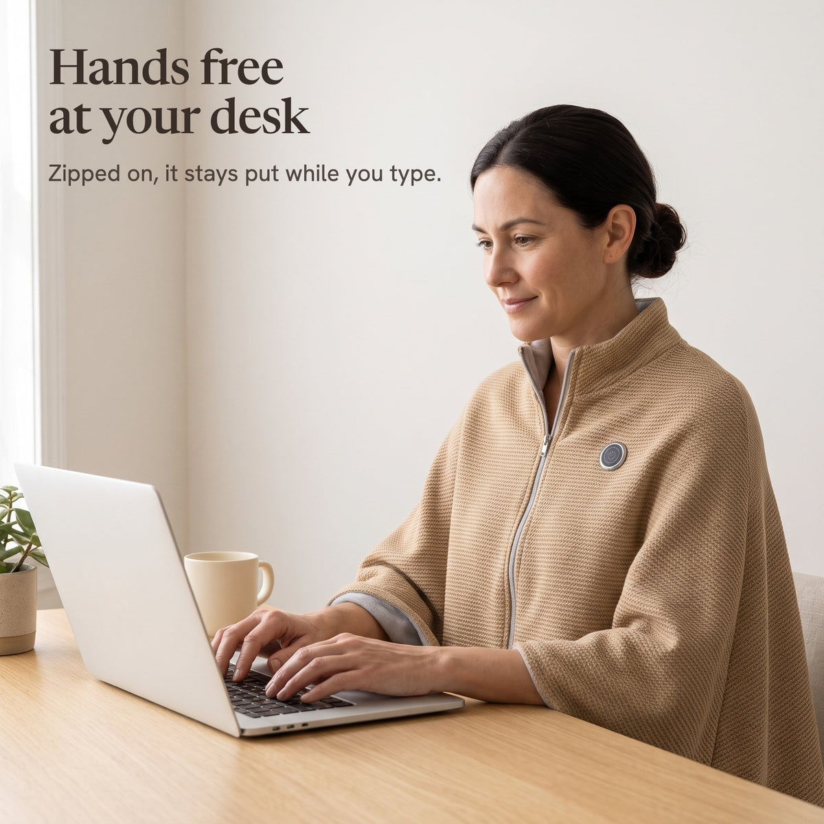 Woman typing at a desk in the camel wrap, hands free