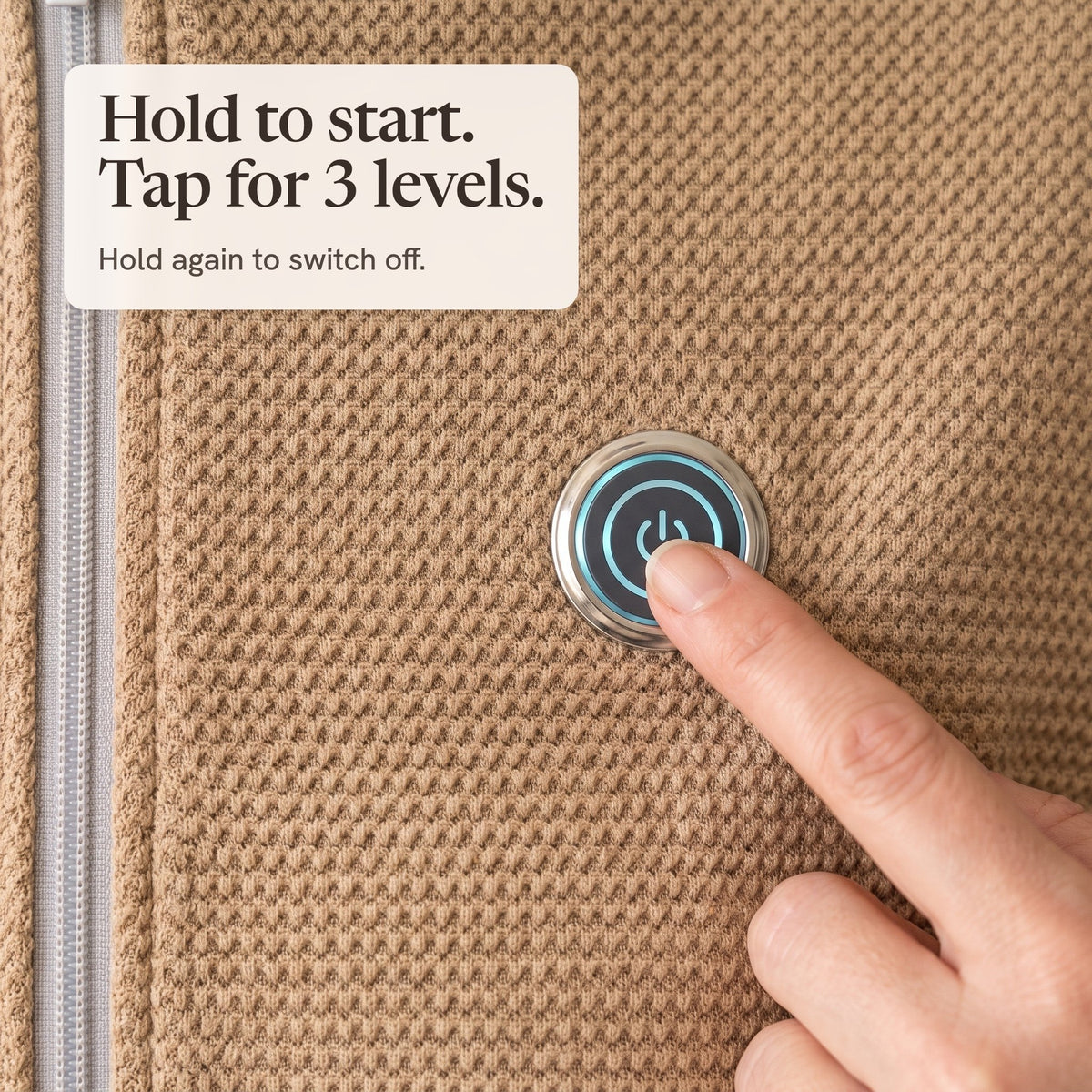 Finger pressing the lit button on the camel wrap