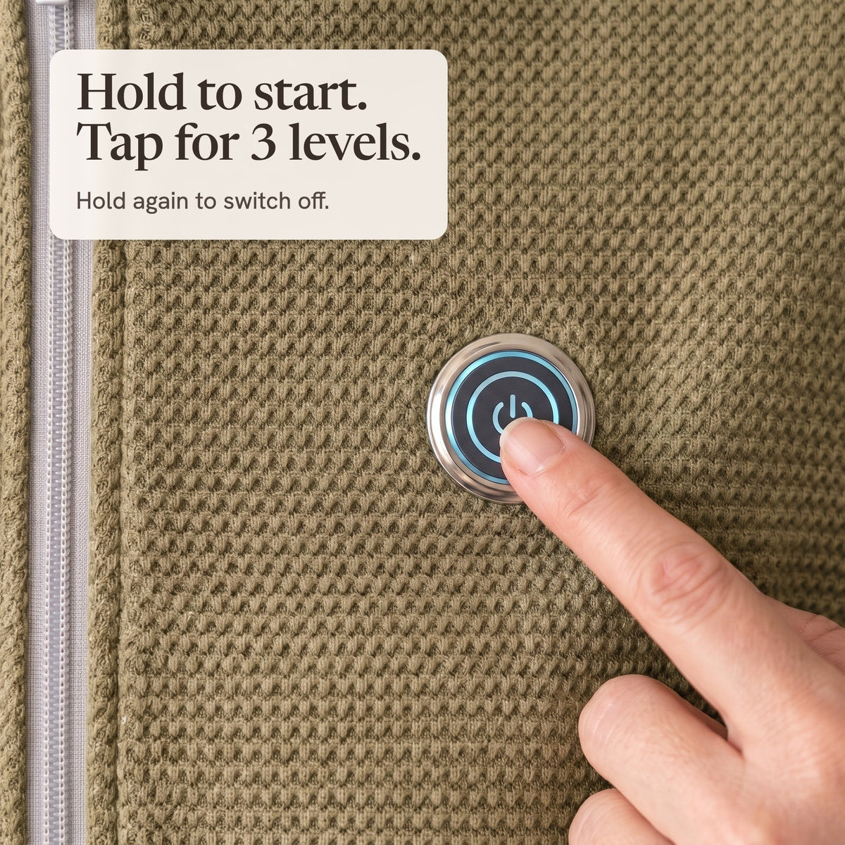 Finger pressing the lit button on the olive wrap