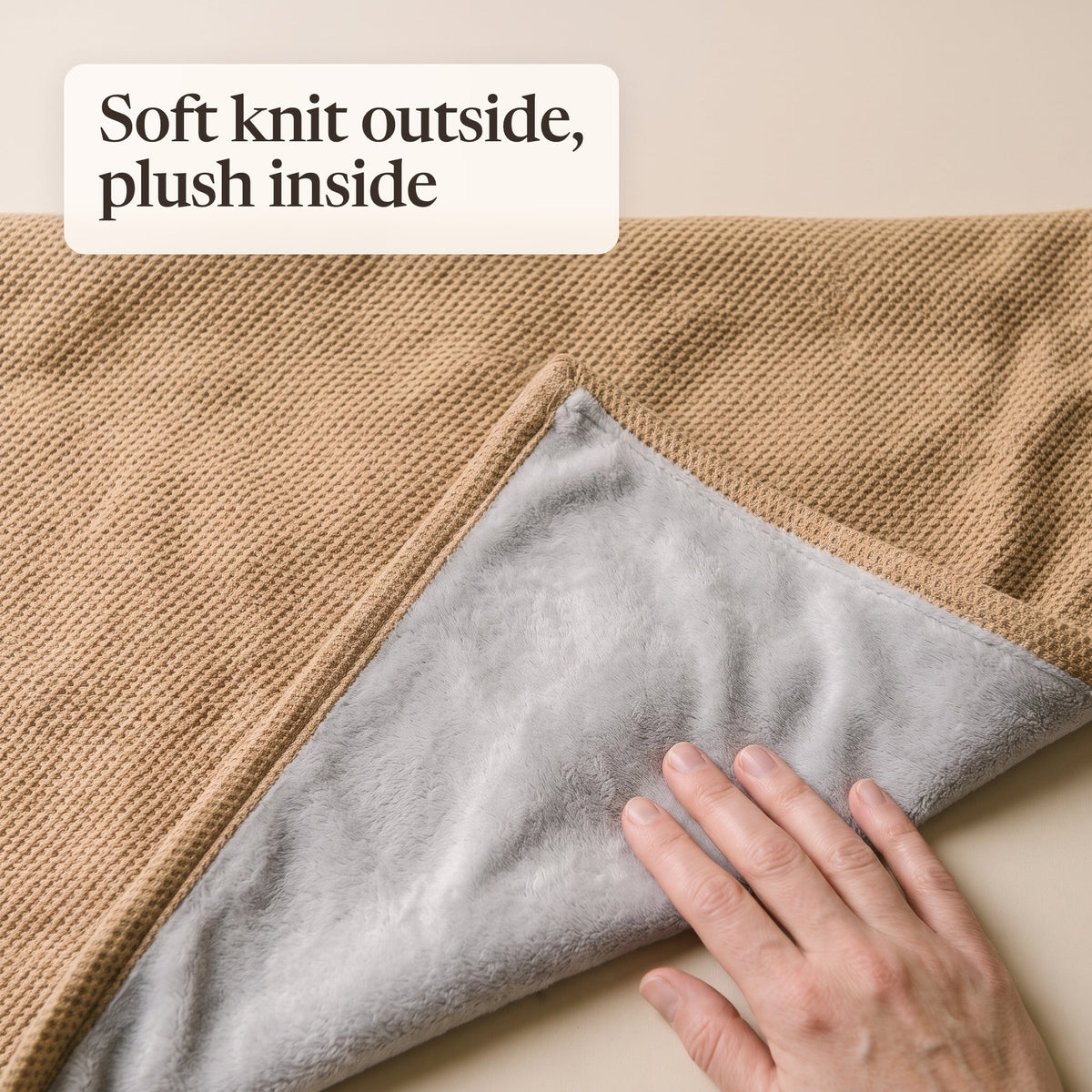 Folded corner of the camel wrap showing the waffle knit and grey plush lining