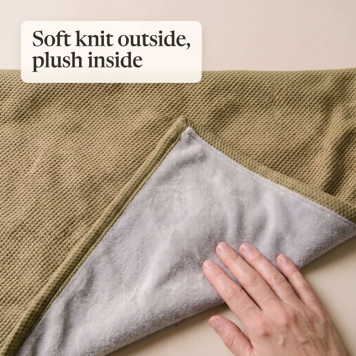 Folded corner of the olive wrap showing the waffle knit and grey plush lining